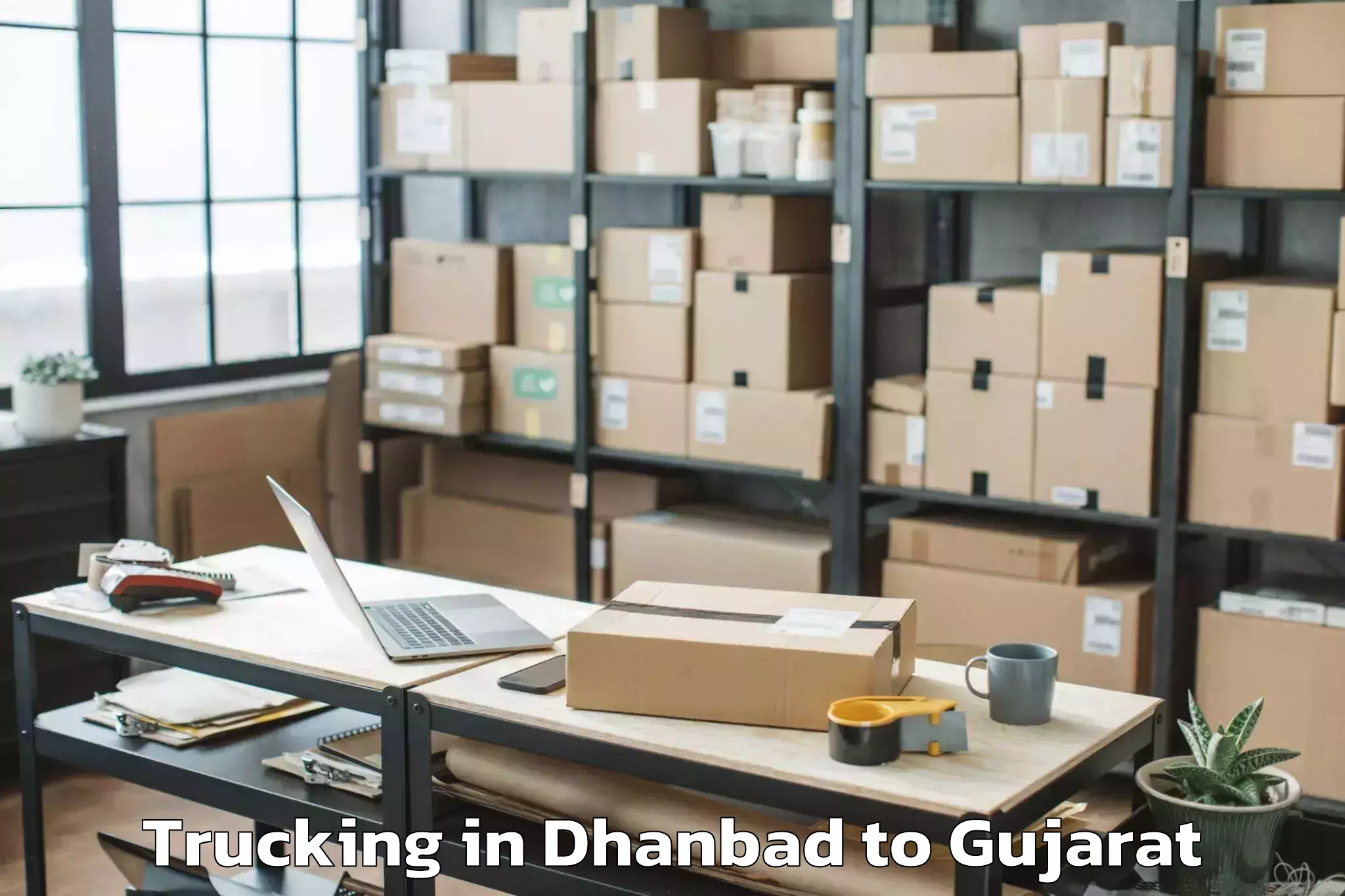 Reliable Dhanbad to Shree Somnath Sanskrit Univers Trucking